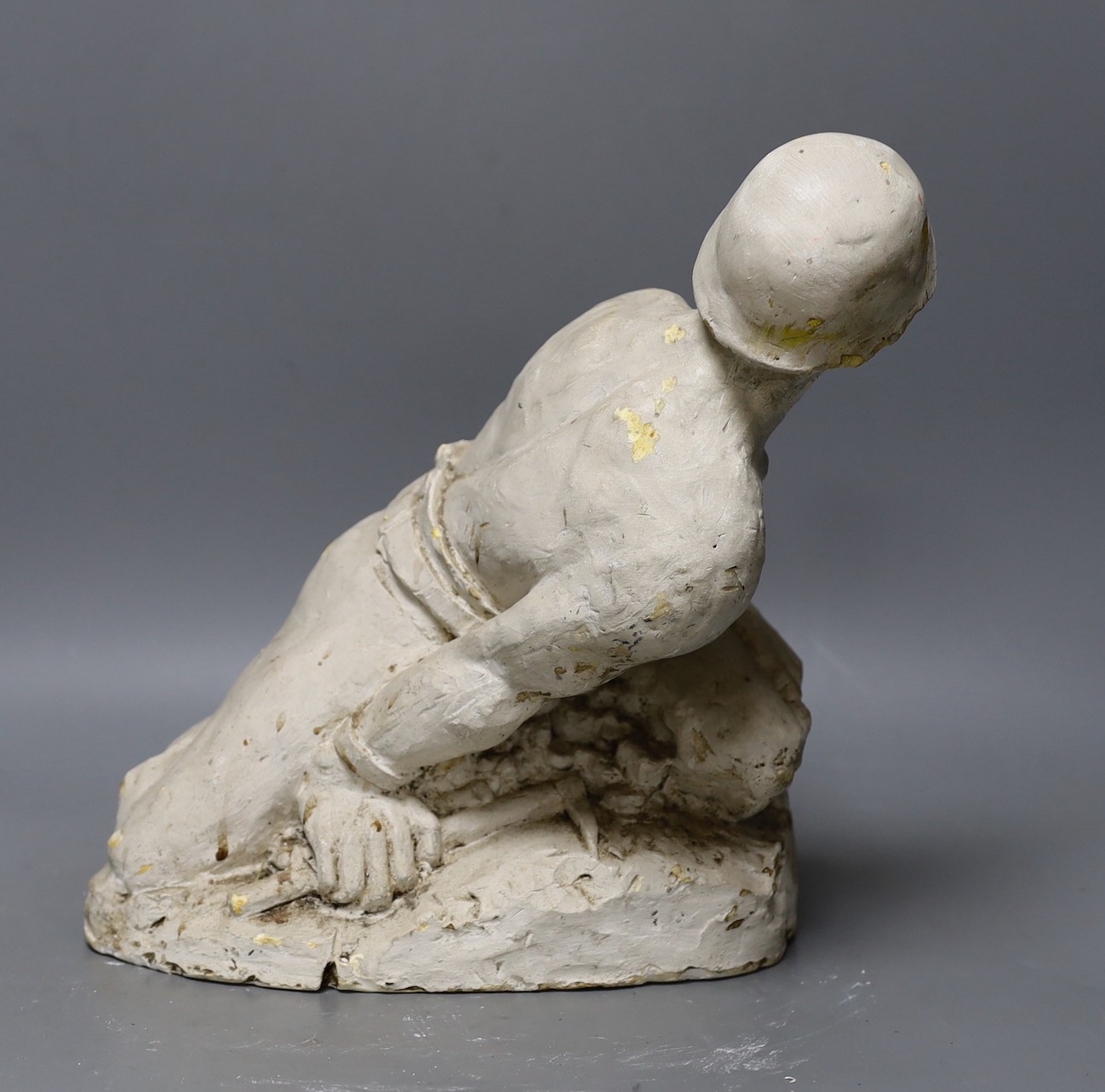 A plaster cast model of a miner, Brutaluit manner, signed L.S Odoarde? 29cm